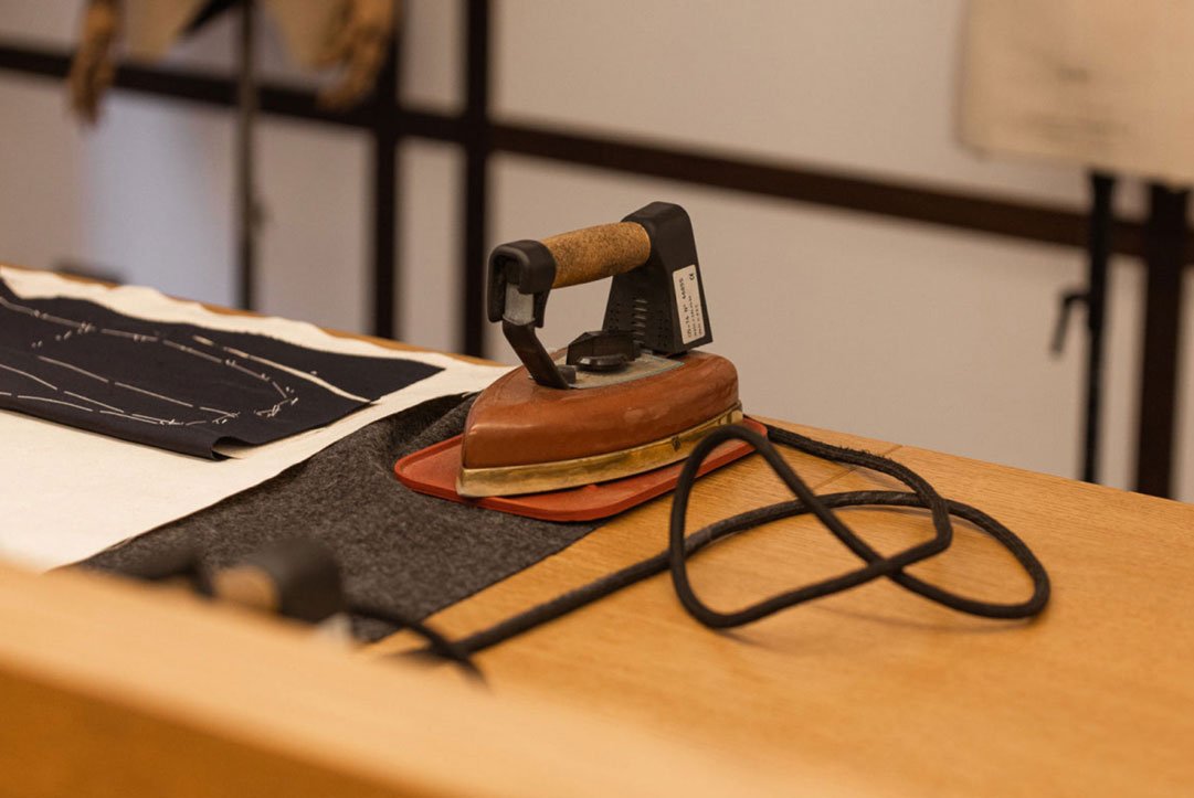 Client fitting for a custom hand-sewn Italian suit at DELETTO Milano Binghamton atelier – premium Scabal, Loro Piana, Drago and Dormeuil fabrics for bespoke tailoring in upstate New York